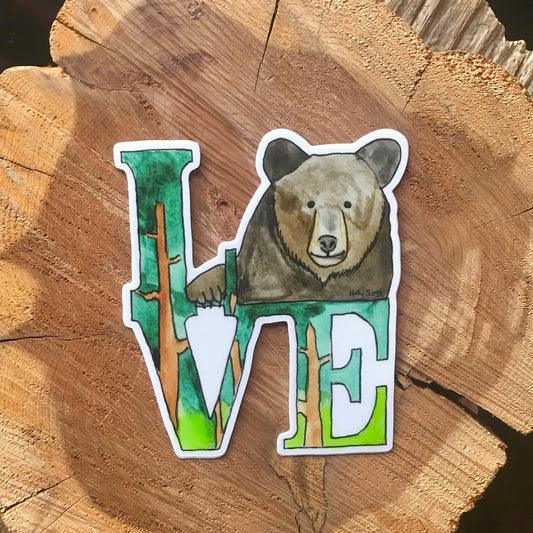 A sticker of the famous LOVE statue with a black bear replacing the O