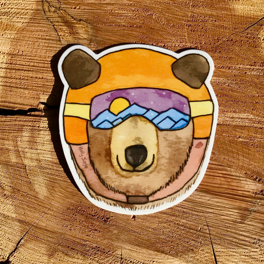 Black bear sticker in ski goggles and helmet