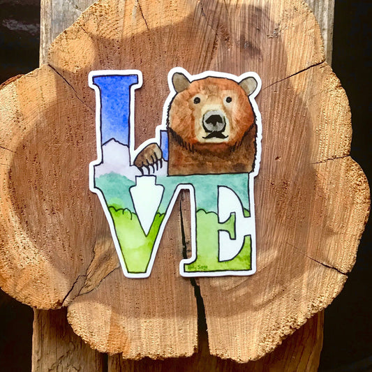 LOVE statue sticker with a grizzly bear in place of the O