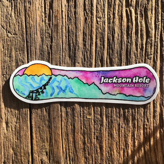 A snowboard sticker with a ski resort painted on the inside