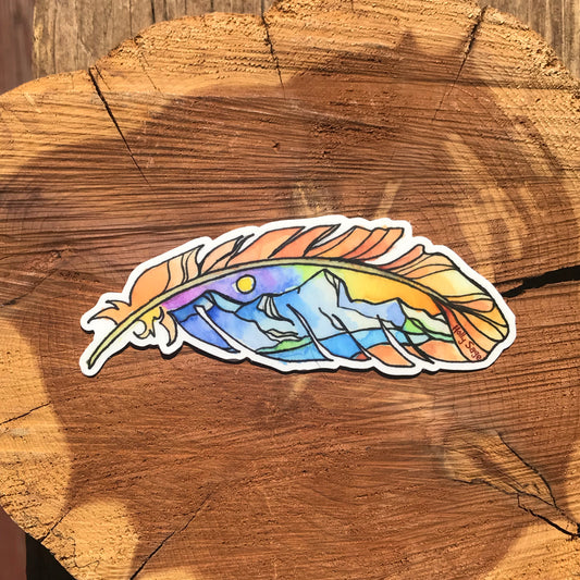 Mountain landscape at sunset inside a feather outline sticker