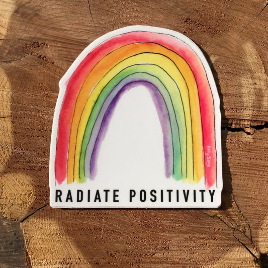 Rainbow sticker with the words Radiate Positivity below