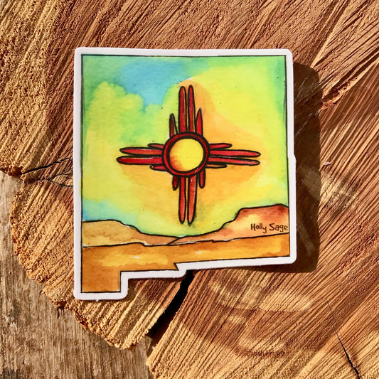 Zia symbol and desert landscape inside a New Mexico state outline sticker