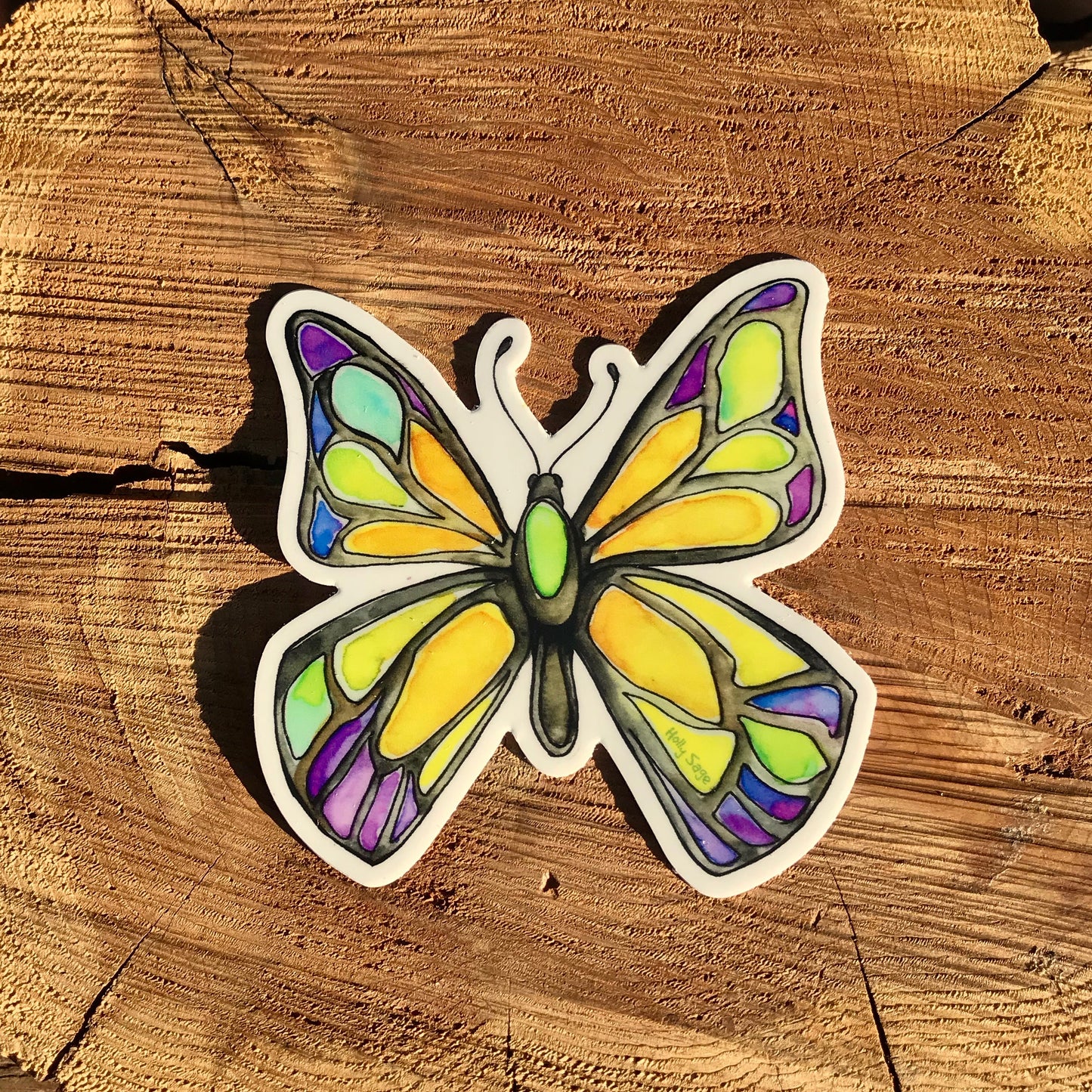 A butterfly sticker painted in the style of stained glass