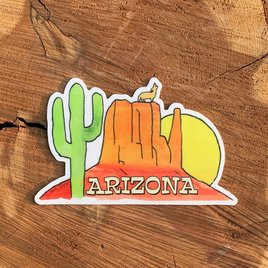 Arizona sticker with sandstone butte, saguaro cactus, sunset, and howling coyote