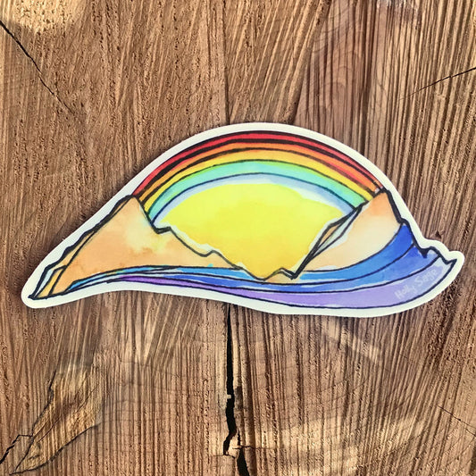 Mountains connected by a rainbow sticker